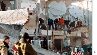 Rescue workers combing through the rubble of the headquarters of the government in Chechnya.