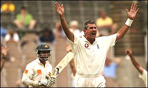 Aussie opener Justin Langer watches as Andrew Caddick appeals for lbw