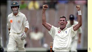 Andrew Caddick celebrates taking the wicket of Justin Langer