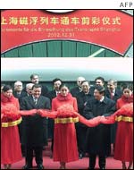 Chinese Premier Zhu Rongji (2nd R) and German Chancellor Gerhard Schroeder (2nd L) attend the ribbon-cutting ceremony