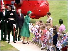 Queen Elizabeth is greeted by schoolchildren at Hillsborough