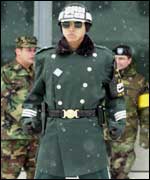 A South Korean soldier stands guard with the U.S. soldiers posted on behind at the border village of the Panmunjom