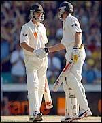 Gilchrist (right) shakes hands with Waugh