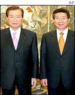 South Korean President Kim Dae-jung and successor Roh Moo-hyon