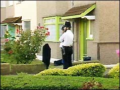 Policeman guards Schulzes' house 
