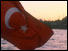 Photo of Turkish flag in front of Istanbul skyline