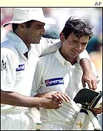 Saqlain (right) is consoled by his captain