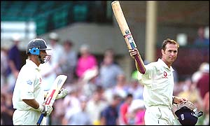 England captain Nasser Hussain claps as Michael Vaughan acknowledges the crowd when they leave the field at the close of play