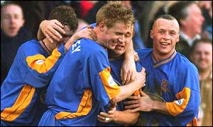 Nigel Jemson is congratulated by team-mates