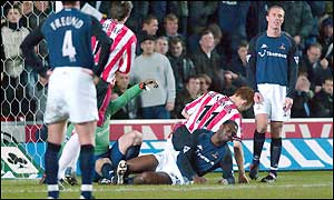 Saints' Michael Svensson prods the ball home to leave Spurs facing an uphill task