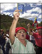 Chavez supporter holds copy of Venezuelan constitution