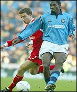 Vladimir Smicer and Lucien Mettomo get in a tangle