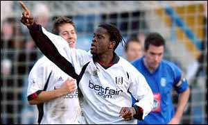 Louis Saha raises his arm to the crowd after grabbing Fulham's third goal