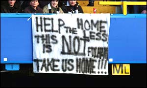 Fulham fans display a banner complaining about having no home ground of their own