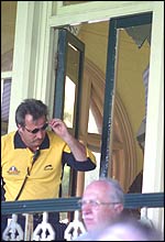 A security officer inspects the damage