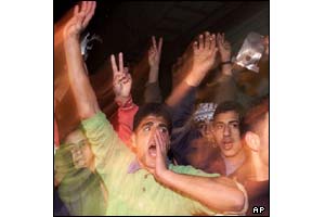 Palestinians gathered outside the factory