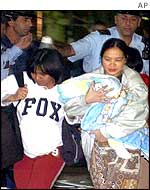 Women leaving the scene of the blasts