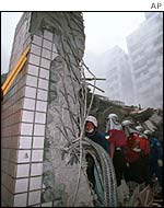 A 12-storey building collapses after an earthquake in Taiwan