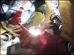 The crews shake hands as they dock