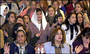 Egyptian Christians pray during Christmas services at Cairo's Coptic Cathedral