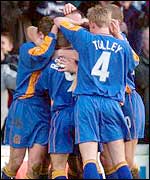 Shrewsbury players celebrate their FA Cup win over Everton
