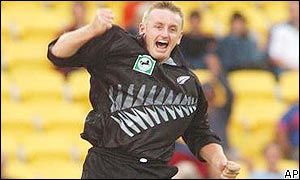 Scott Styris of New Zealand celebrates the wicket of India's Rahul Dravid