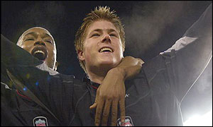 Neil Mellor of Liverpool is congratulated by El Hadji Diouf