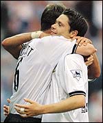 Chris Riggott and Malcolm Christie celebrate a Derby victory