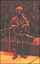 Sergeant Karl Scott trying on the protective suit