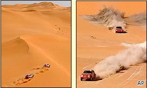 Mitsubishi team-mates Hiroshi Masuoka of Japan and Stephane Peterhansel of France race side by side