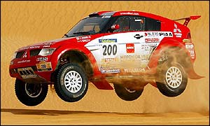Hiroshi Masuoka and co-driver German Andreas Schulz drive their Nisan Pajero during the sixth stage 