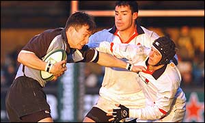 Ulster's Bryn Cunningham holds off Nick Walne of Cardiff