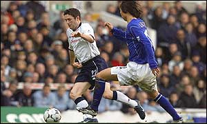 Spurs Robbie Keane takes it past Li Tie