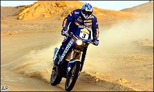 French motorcyclist Richard Sainct negotiates his KTM between Zilla and Sarir in the Libyan desert