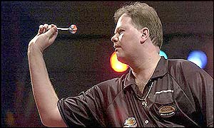 Barneveld lines up a dart as he nears victory