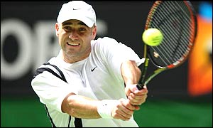 Andre Agassi hits a two-handed backhand