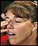 Jennifer Capriati rubs her eyes in her news conference