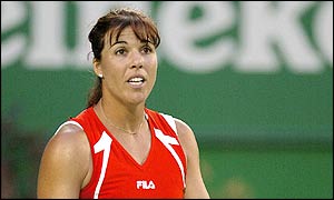 Capriati reacts to a line call in the third set of the match