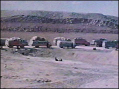 Convoy of refugee vehicles