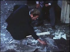 Police examine the damage after the blast