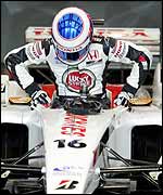 Jenson Button climbs out of the new BAR after its first test