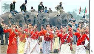 Assamese dancers in traditional dress perform for the festival crowds