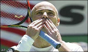 Andre Agassi salutes the crowd after his comprehensive victory