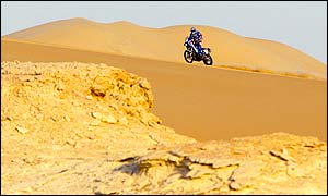 France's Richard Sainct rides across the sand during stage 13, finishing in second place but maintaining his overall lead