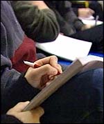 student taking lecture notes 