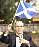 Mr Al-Ani raising a glass to Scotland