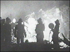 Firefighters at the scene of the burning plane