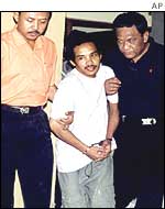 Ali Imron, centre, at the regional police headquarters in Denpasar on Friday 17 January 