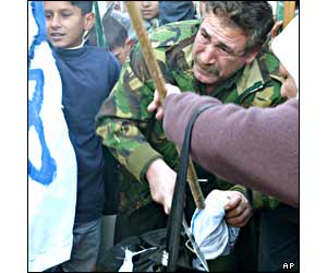 Man decapitating doll