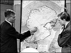 Vivian Fuchs (left) explains the journey to David Attenborough